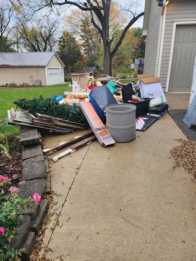 Dumpster being loaded with debris for Residential Dumpster Rental in Scituate